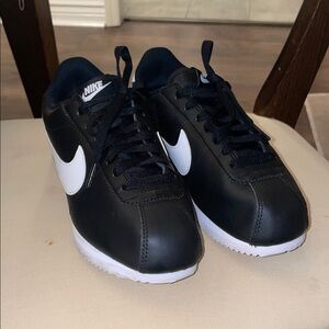 Nike womens Black Sneakers with White Accents